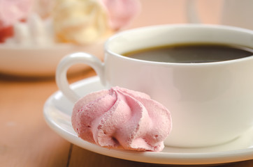 coffee in a white cup and meringue/coffee in a white cup and meringue close up