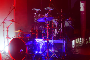Fototapeta na wymiar Drums on the stage, illuminated
