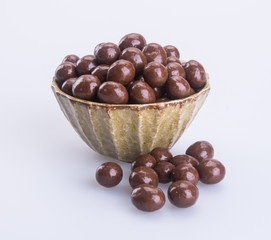 chocolate balls. chocolate balls in bowl on a background