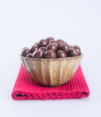 chocolate balls. chocolate balls in bowl on a background