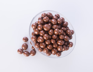 chocolate balls. chocolate balls in bowl on a background