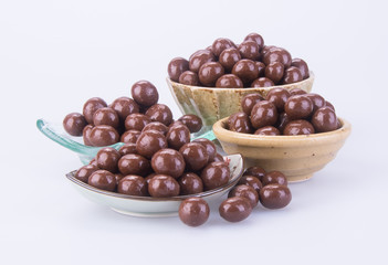 chocolate balls. chocolate balls in bowl on a background