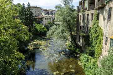 Fototapeta na wymiar sight of the river Fluvia to its step along the town of Olot in Gerona, Spain.