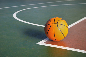 orange basketball on court in gymnasium sport competition floor background