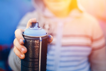guy is holding a Close-up ballon with a paint for graffiti