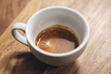 fresh espresso in cappuccino cup on table