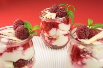 layered dessert with raspberry, cream cheese and white chocolate