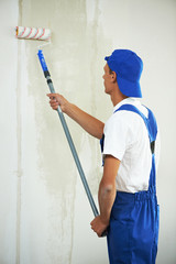 painter at home renovation work with prime
