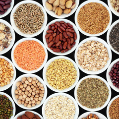 Dried high fiber health food with legumes, cereals, nuts, grain, seeds, with foods high in omega 3 fatty acid, antioxidants and vitamins, top view.