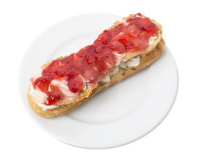 Delicious eclair with strawberry jam.