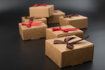 A few cardboard boxes for a gift on a black background