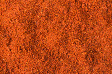 Panele Szklane  przyprawa chili w proszku jako tło, naturalna tekstura przyprawy