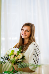 Beautiful girl in clothes with embroidery