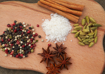 Various seasonings on wooden background