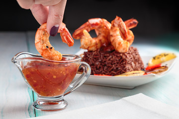 king prawns with spicy sauce and red rice