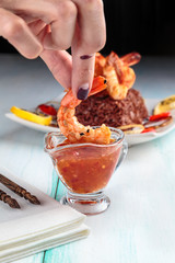 king prawns with spicy sauce and red rice