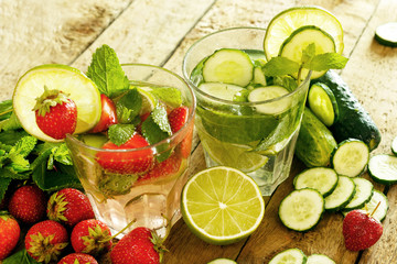 Refreshing drink with strawberry, lime and cucumber