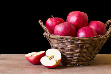 Fototapeta na wymiar Red apples in a wicker basket