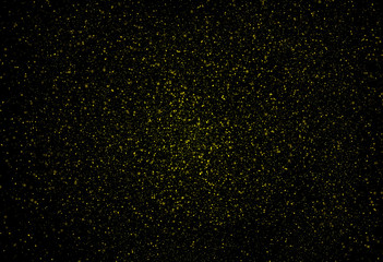 Fototapeta na wymiar abstract gold dust floating on a black background