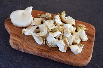 Fried oyster mushrooms on wooden cutting board