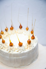 White cake with nuts in caramel