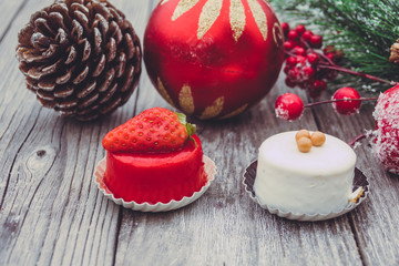 An array of Christmas desserts with colorful   , on wooden board