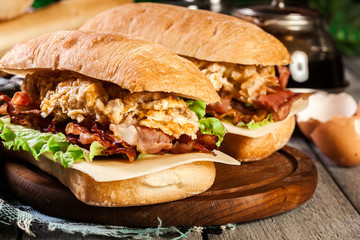 Ciabatta sandwich with smoked bacon and eggs