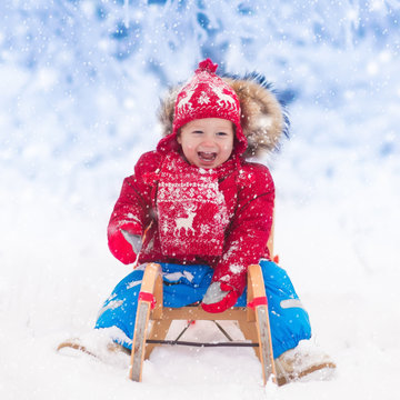 Kids Play In Snow. Winter Sleigh Ride For Children