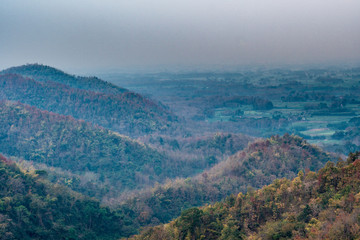 Drought mountains in autumn with pollution in sky