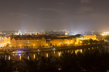 The embankment of the Vltava River in the center of Prague at night. Czech Republic