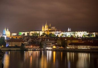 Prague Castle, Czech Republic. Light of lanterns reflected in the river Vltava.