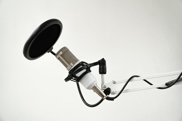 Professional condenser studio microphone on the white background