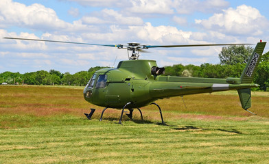 Fototapeta na wymiar Military helicopter at the airport in summer