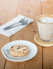 Chocolate chip cookies with coffee in a glass cup