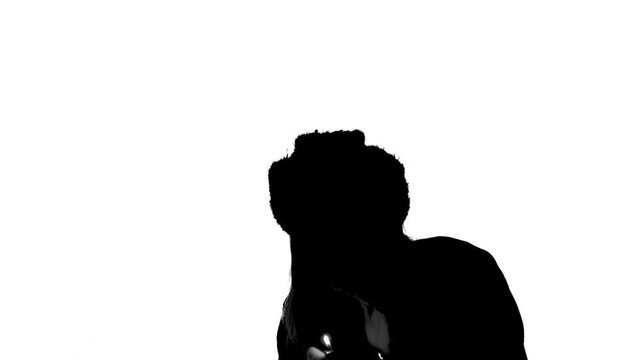 Silhouette of woman with gas lighter