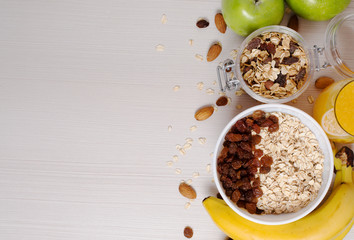 Healthy Breakfast. Granola, apples, bananas, oatmeal with raisins, honey, nuts. Measuring tape