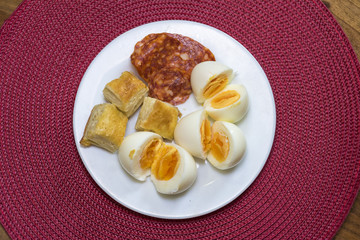 boiled eggs, dough and sausages