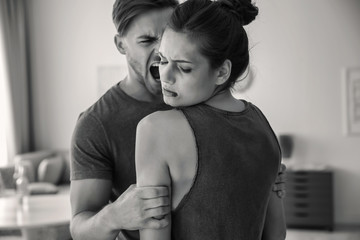 Young woman subjecting to violence at home