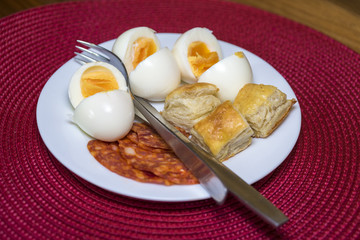 boiled eggs, dough and sausages