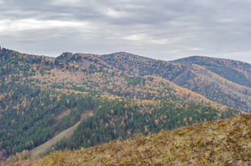 Fototapeta na wymiar Mountain landscape on a cloudy autumn day in Russia, Syberia