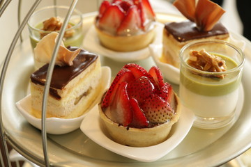 Assortment of pieces of cake in plate