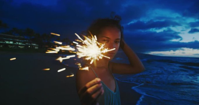 Woman with Sparkler at Sunset