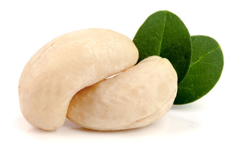 cashew nuts with leaf isolated on white background. macro
