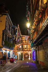 Christmas Colmar, France.Traditional old half-timbered houses in historic city of Colmar,decorated and lighted during the Christmas season, Alsace.Beautiful multi-colored Christmas.