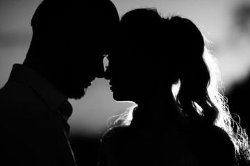 silhouettes of the young couple of the bride and groom