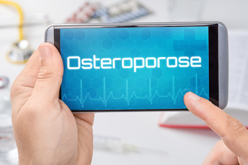 Smartphone mit dem Text Osteroporose auf dem Display