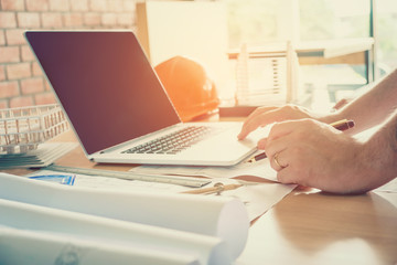 Architect or engineer working in office on blueprint. Architects workplace © joyfotoliakid