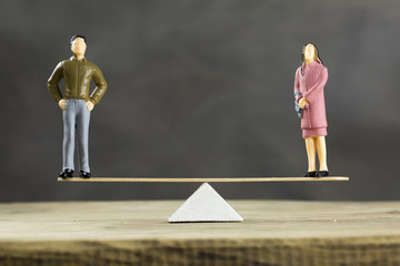 Balanced Scale With a Man and Woman
