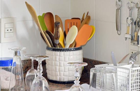 Kitchen Niche With Pot Of Wooden Spoons And Dishwasher Washed