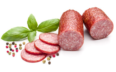 Salami smoked sausage, basil leaves and peppercorns isolated on white background cutout